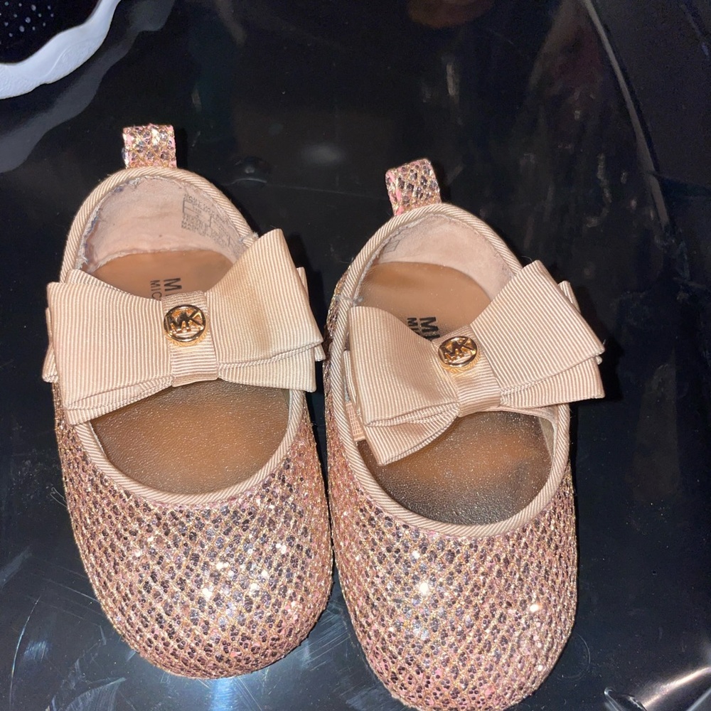 Rose gold micheal kors shoes for girls.